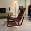 Cite fauteuil - van Vitra, Rode stoffering naar het ontwerp van Jean Prouvé. Nu verkrijgbaar in de showroomsale bij Hartman Binnenhuisadviseurs.
